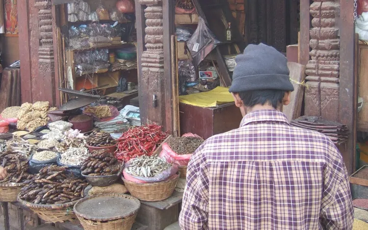 A market stall with dried fish and chillies in baskets, for scale dealers and distributors