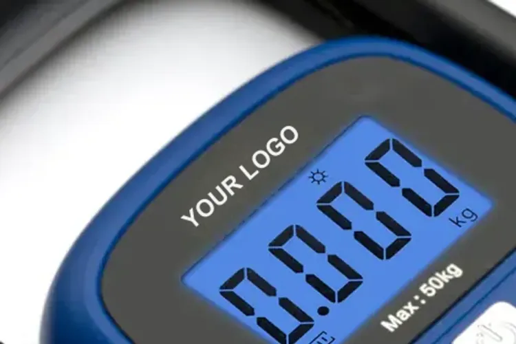 Close-up of a blue luggage scale with YOUR LOGO printed beside the backlit display