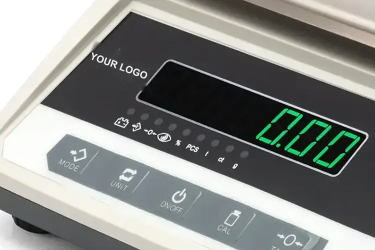 Close-up of a jewellery scale front panel with YOUR LOGO printed beside the green LED display