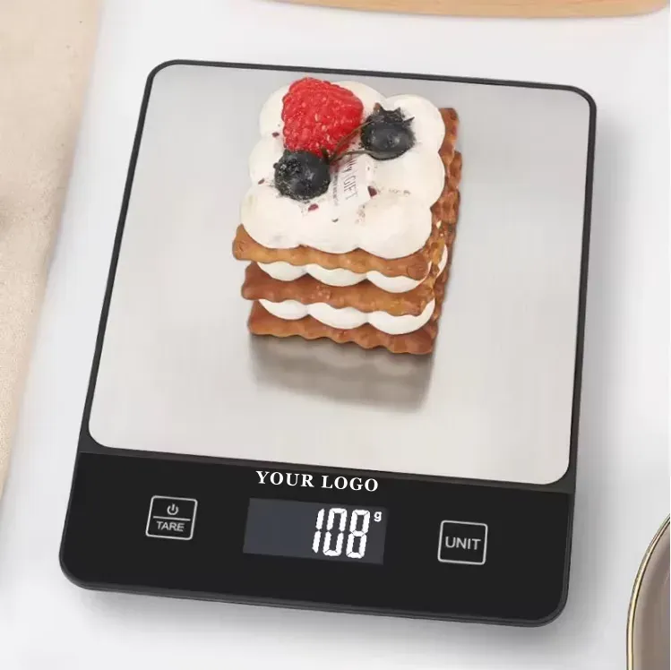 OEM-305 stainless steel kitchen scale weighing a layered pastry at 108 g, YOUR LOGO on the panel