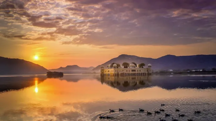 Jal Mahal palace at sunset on Man Sagar Lake in Jaipur, Rajasthan.